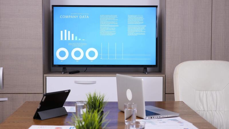 close-up-of-empty-business-meeting-room-with-big-tv-and-animated-data-displayed-on-big-screen-tv-4k-footage-video close-up-of-empty-business-meeting-room-with-big-tv-and-animated-data-displayed-on-big-screen-tv-4k-footage-video